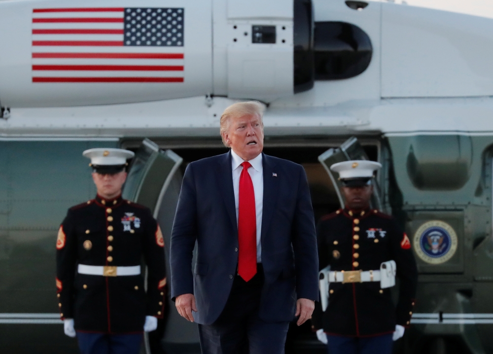 US President Donald Trump arrives from a fund-raising event before departing for Washington D.C.,  at Cleveland Hopkins International Airport in Cleveland, Ohio, US, on Saturday. — Reuters