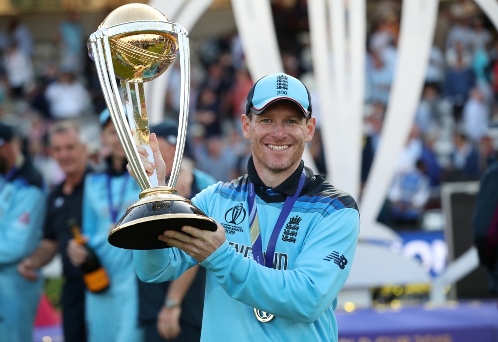 England's Eoin Morgan and teammates celebrate winning the world cup with the trophy after beating New Zealand in the ICC Cricket World Cup Final at  Lord's, London, Britain, on Sunday. — Reuters