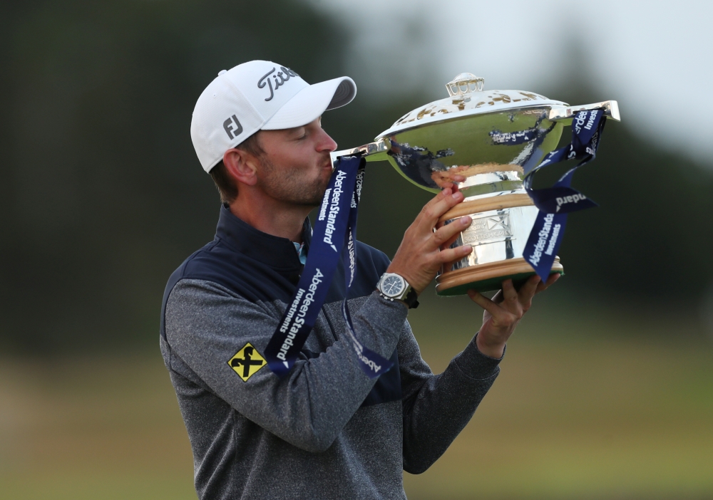 Austria's Bernd Wiesberger celebrates with the trophy after winning the Scottish Open at The Renaissance Club, North Berwick, Britain, on Sunday. — Reuters