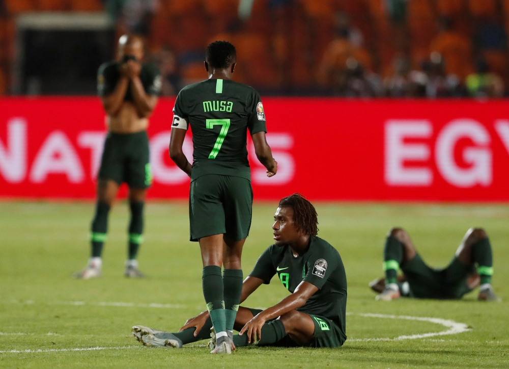 Nigeria's Ahmed Musa and Alex Iwobi look dejected after the Cup of Nations semifinal match at International Stadium, Cairo, Egypt, on Sunday. — Reuters