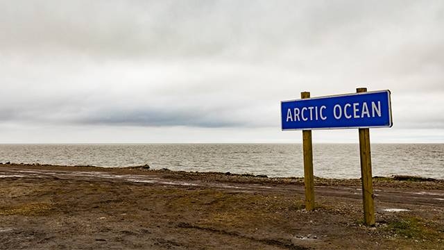 A signpost marks the Arctic Ocean at the shore of Beaufort Sea in Tuktoyaktuk, Northwest Territories, Canada. –Courtesy photo