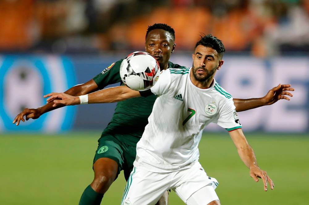 Algeria's forward Riyad Mahrez (R) vies for the ball with Nigeria's forward Ahmed Musa during the 2019 Africa Cup of Nations (CAN) semifinal football match against Nigeria at the Cairo International stadium in Cairo on Sunday. — AFP