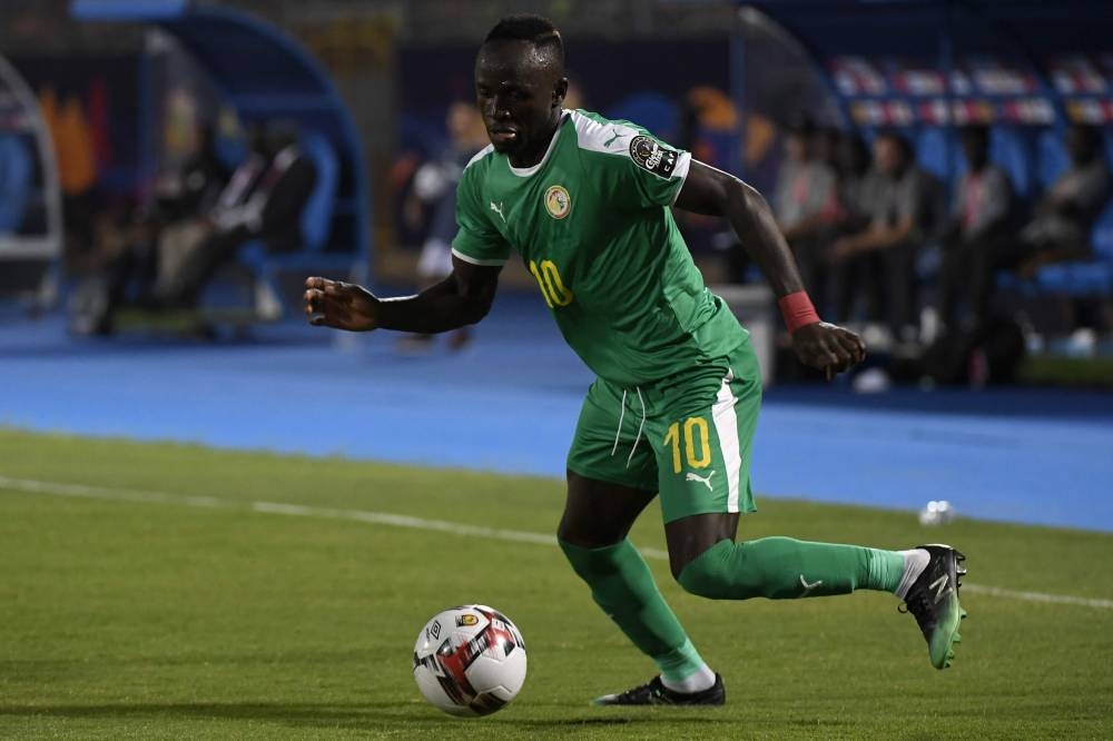 Algeria's forward Riyad Mahrez (R) vies for the ball with Nigeria's forward Ahmed Musa during the 2019 Africa Cup of Nations (CAN) semifinal football match against Nigeria at the Cairo International stadium in Cairo on Sunday. — AFP