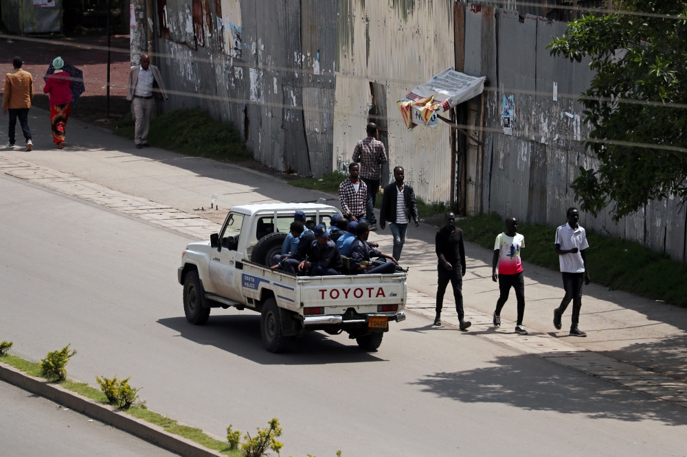 Armed security officers patrol the street during a clash between a Sidama youth and a securities after they declared their own region in Hawassa, Ethiopia, on Thursday. — Reuters