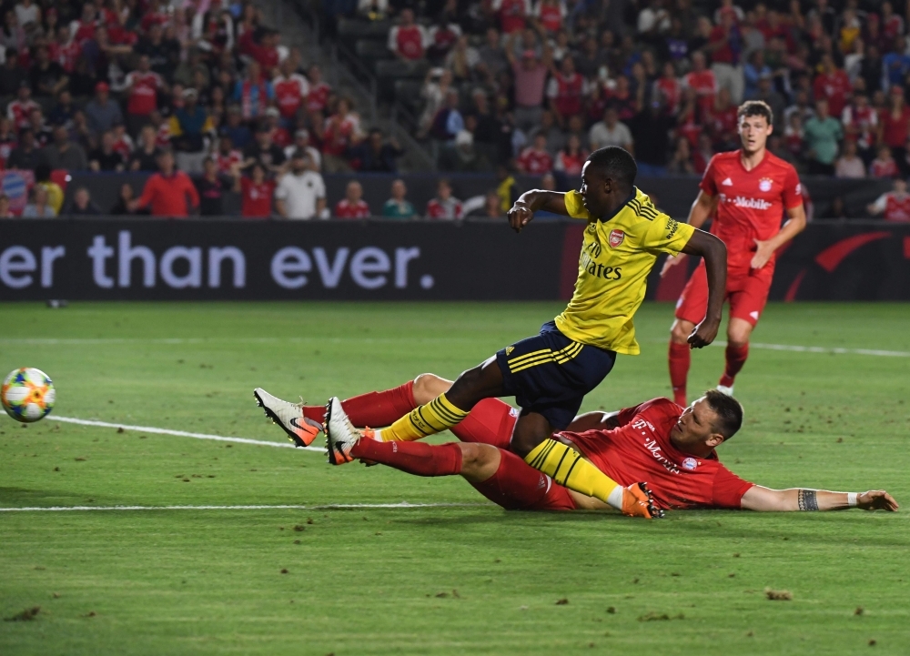 Forward Eddie Nketiah of Arsenal (C) shoots and scores the winning goal against Bayern Munich during their International Champions Cup football match at the Dignity Health Stadium in Carson, California on Wednesday. — AFP
