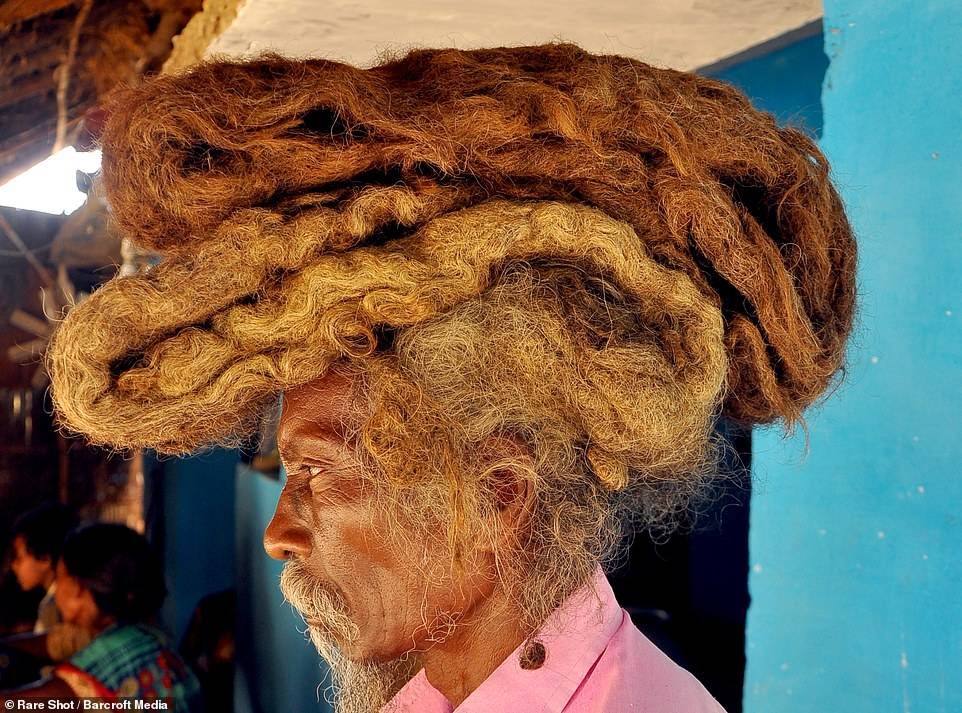 Tuddu, 63, from India's Bihar state, wears his six-foot-long mat of hair on top of his head like a turban wrapped in a white cloth.