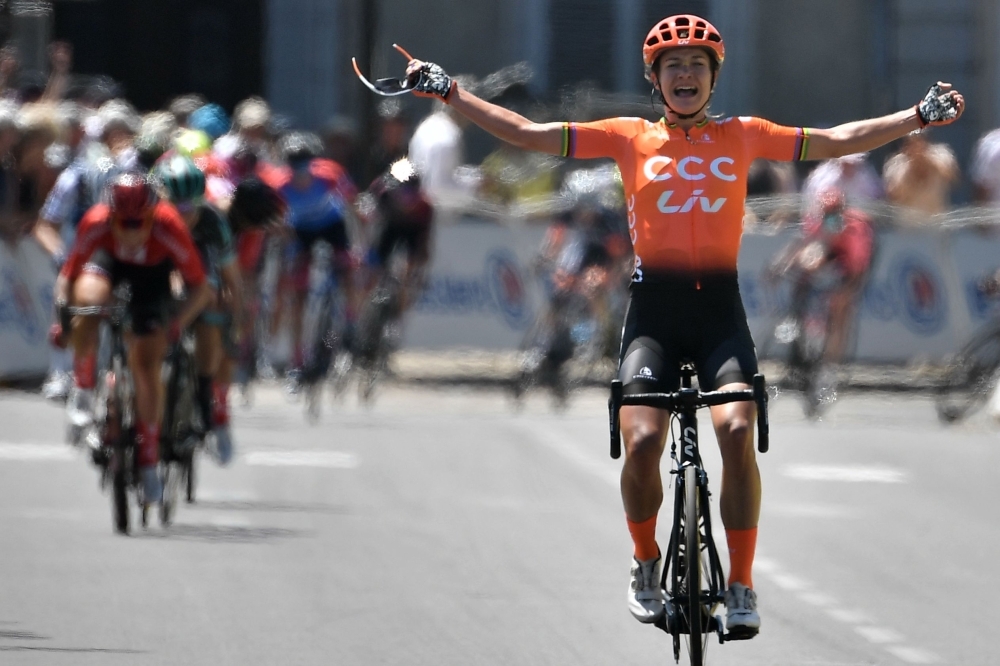 The Netherlands' Marianne Vos celebrates as she crosses the finish line of 