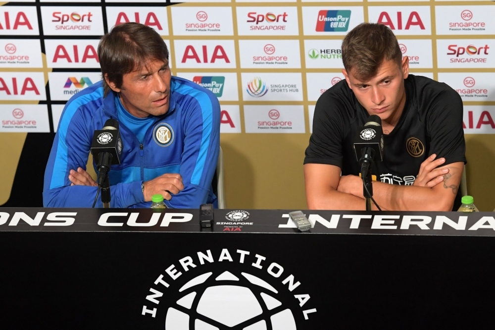 Inter Milan's manager Antonio Conte (L) and player Nicolo Barella attend a press conference in Singapore on Friday ahead of the team's International Champions Cup football match against Manchester United. — AFP