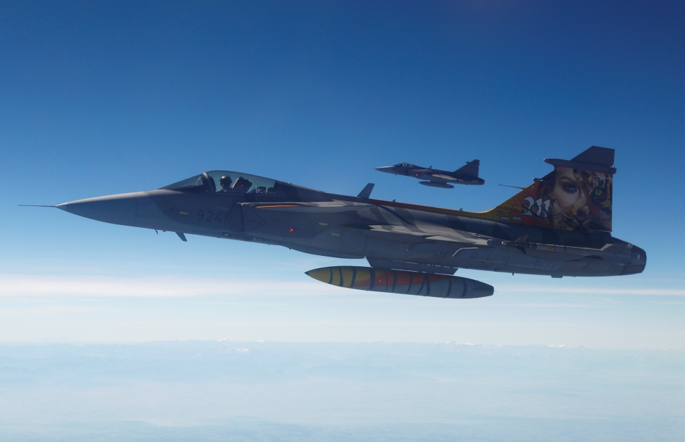 Two Czech Gripen fighter planes demonstrate a flight interception of a Belgian air force transport plane over the Czech Republic as part of NATO drills in this in this Sept. 12, 2018 file photo. — Reuters