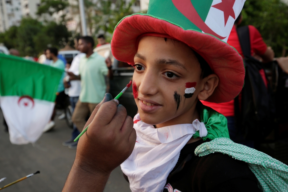 An Algeria fan in Cairo has his face painted ahead of the Africa Cup of Nations 2019 - Final against Senegal in Cairo, Egypt  on Friday. — Reuters