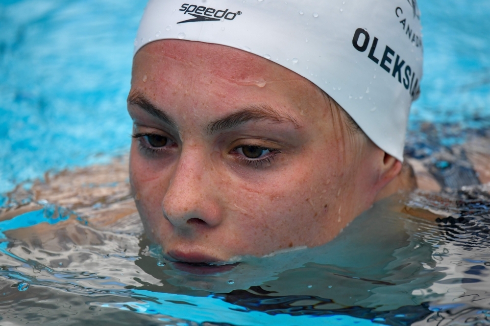 In this file photo taken on April 5, 2018, Canada's Penny Oleksiak swims out after the swimming women’s 200m freestyle qualifications during the 2018 Gold Coast Commonwealth Games at the Optus Aquatic Center in the Gold Coast. Oleksiak. — AFP