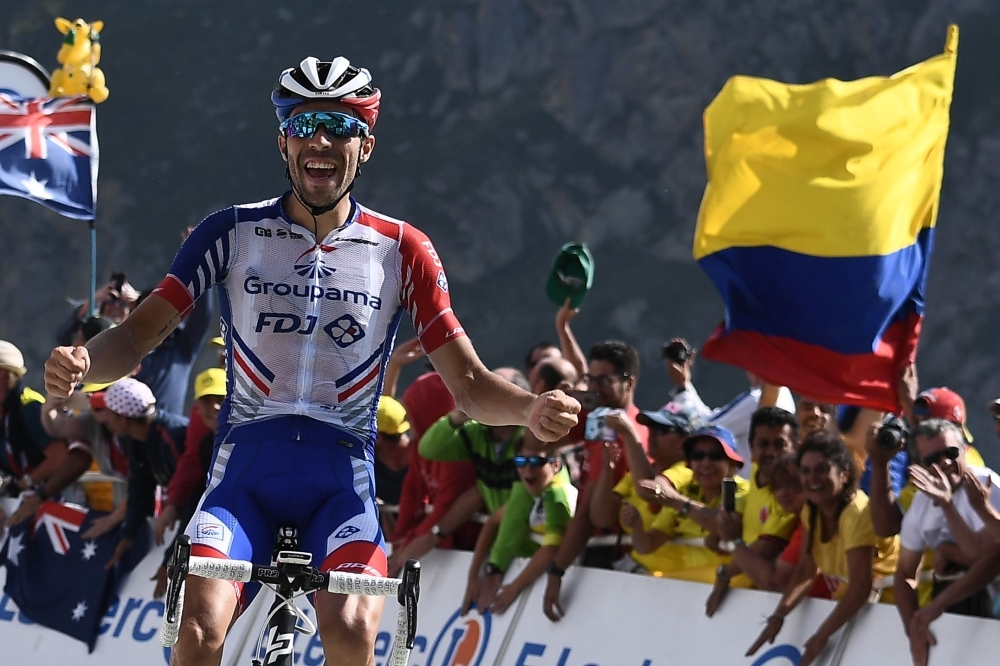 France's Thibaut Pinot celebrates as he wins on the finish line of the fourteenth stage of the 106th edition of the Tour de France cycling race between Tarbes and Tourmalet Bareges, in Tourmalet Bareges on Saturday. — AFP