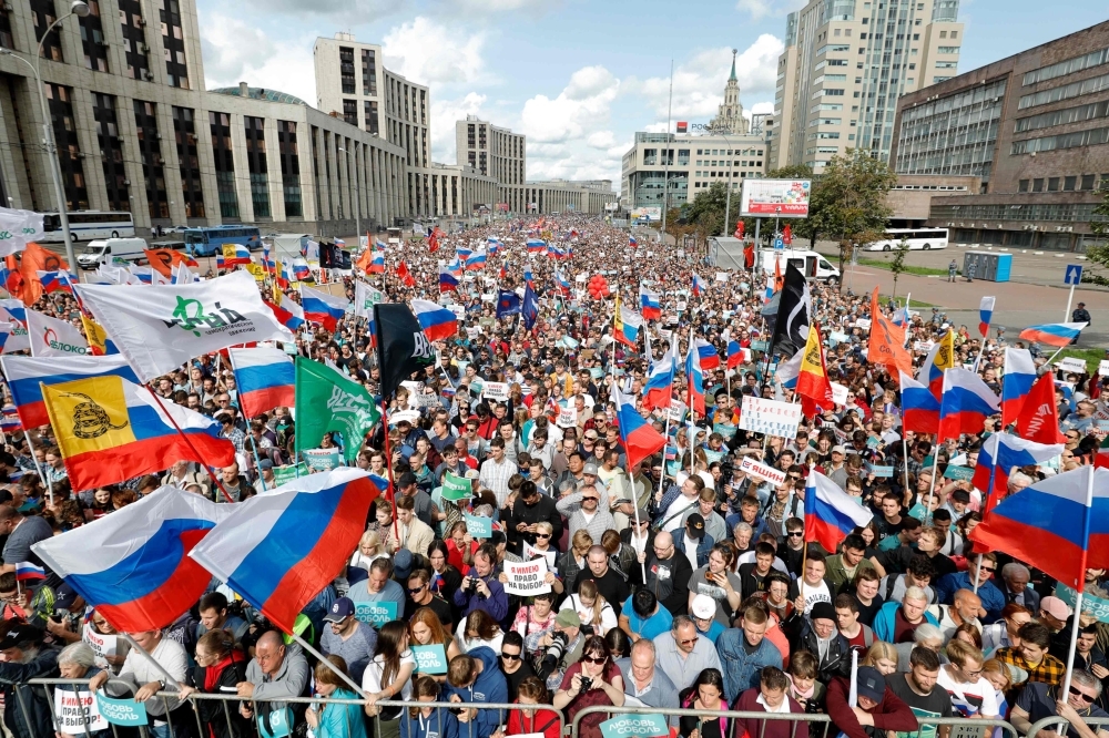 Demonstrators take part in a rally to support opposition and independent candidates after authorities refused to register them for September elections to the Moscow City Duma, Moscow, on Saturday. — AFP 