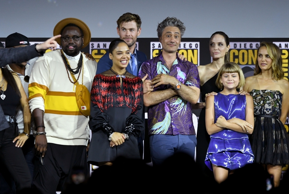 (L-R) Brian Tyree Henry, Tessa Thompson, Chris Hemsworth, Taika Waititi, Angelina Jolie, Lia McHugh and Natalie Portman speak at the Marvel Studios Panel during 2019 Comic-Con International at San Diego Convention Center on Saturday in San Diego, California. — AFP