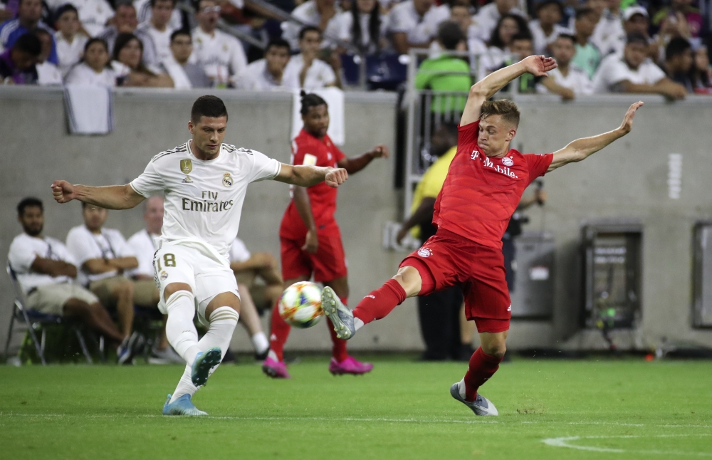 Bayern Munich defender Joshua Kimmich defends the pass of Real Madrid midfielder Luka Jović (L) during the second half of the International Champions Cup soccer series at NRG Stadium in Houston, TX, USA, on Saturday. — Reuters