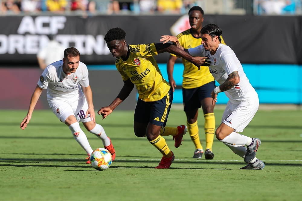 Arsenal side Bukayo Saka presses towards the goal covered by Fiorentina midfielder Sebastian Cristoforo during the International Champions Cup soccer series at Bank of America Stadium in Charlotte, NC, USA, on Saturday. — Reuters