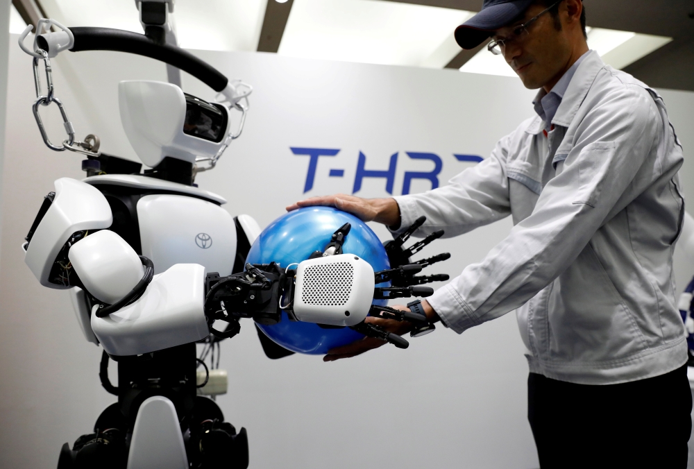 In this picture, Toyota Motor Corp. demonstrates the T-HR3 humanoid robot which will be used during the Tokyo 2020 Olympic and Paralympic Games, in Tokyo. — AFP