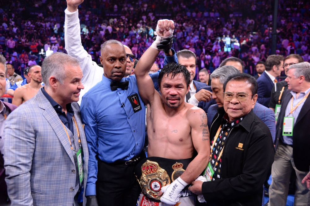Manny Pacquiao (white trunks) celebrates after defeating Keith Thurman (not pictured) in their WBA welterweight championship bout at MGM Grand Garden Arena, Las Vegas, NV, USA, in this Jul 20, 2019 file photo. Pacquiao won via split decision. — Reuters