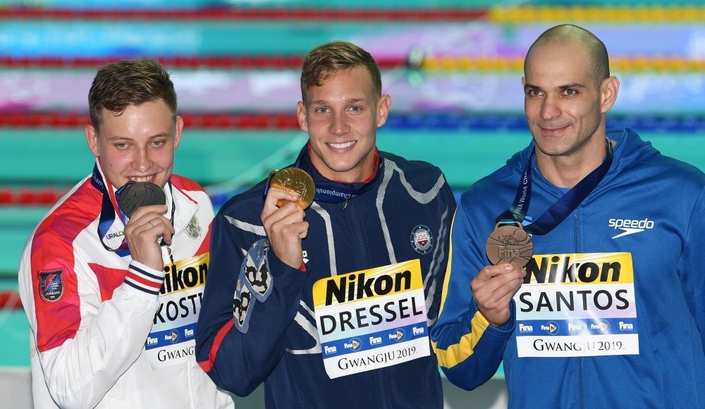 Gold medalist Adam Peaty of Britain (C), silver medalist James Wilby of Britain (L) and bronze medalist Yan Zibei of China pose during the 2019 World Championships men's 100m breaststroke medal ceremony at Nambu University Municipal Aquatics Center, Gwangju, South Korea, on Monday. — Reuters