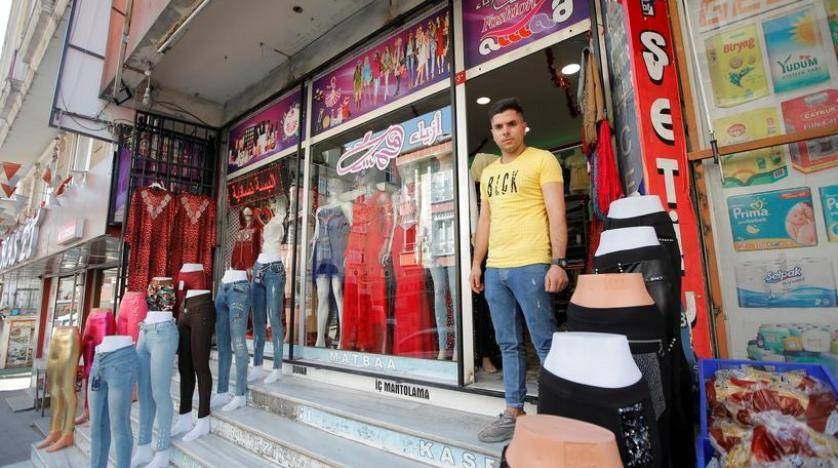 Syrian shopkeeper Mustafa poses in front of his clothes shop in Istanbul's Kucukcekmece district, Turkey, in this July 5, 2019 file photo. — Reuters