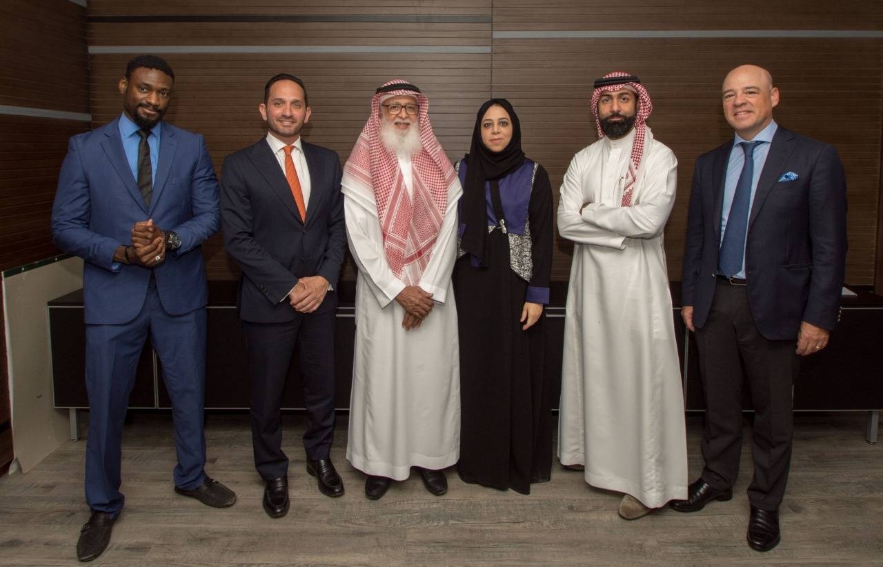 Dr. Adel Abdul Jalil Batterjee (third from left), Chairman of the Board of Directors of Waad Holding Company, poses with some executives