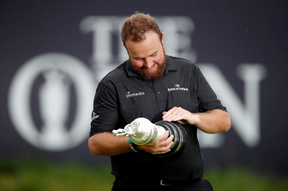 Republic of Ireland's Shane Lowry celebrates with the Claret Jug trophy after winning the Open Championship at Royal Portrush Golf Club, Portrush, Northern Ireland, on Sunday. — Reuters