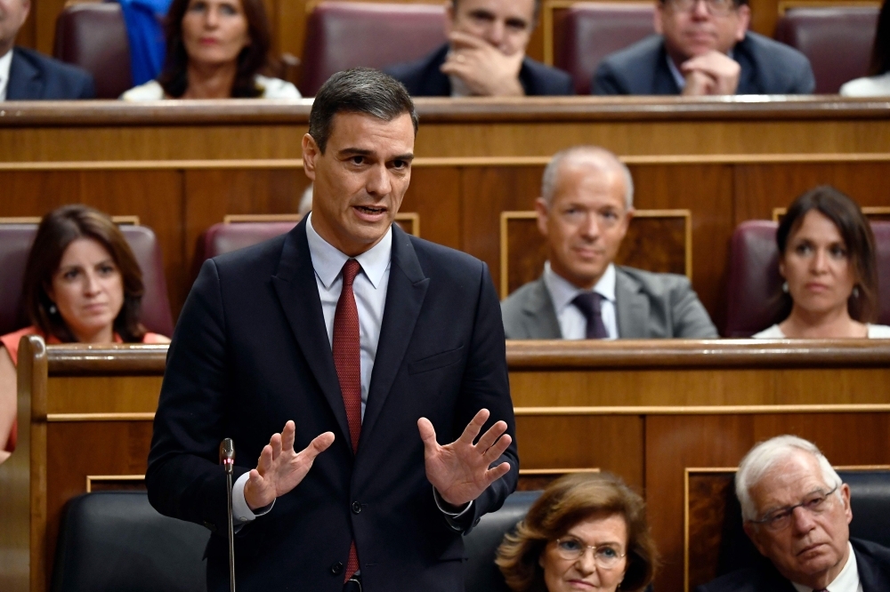 Candidate for re-election as prime minister for a second term, socialist Pedro Sanchez, speaks during the first day of the parliamentary investiture debate to vote through a prime minister, at the Spanish Congress (Las Cortes) in Madrid on Monday. — AFP