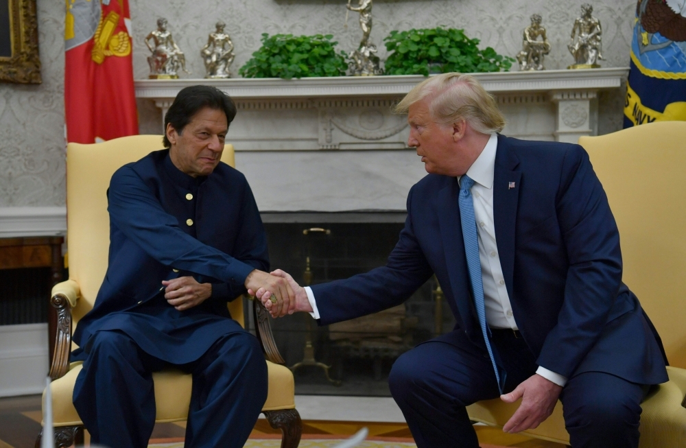 US President Donald Trump meets with Pakistani Prime Minister Imran Khan, left, in the Oval Office at the White House in Washington on Monday. — AFP