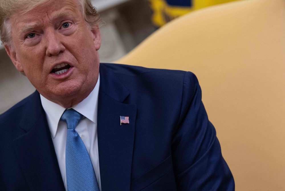 US President Donald Trump speaks during a meeting with Pakistani Prime Minister Imran Khan  in the Oval Office at the White House in Washington on Monday. — AFP