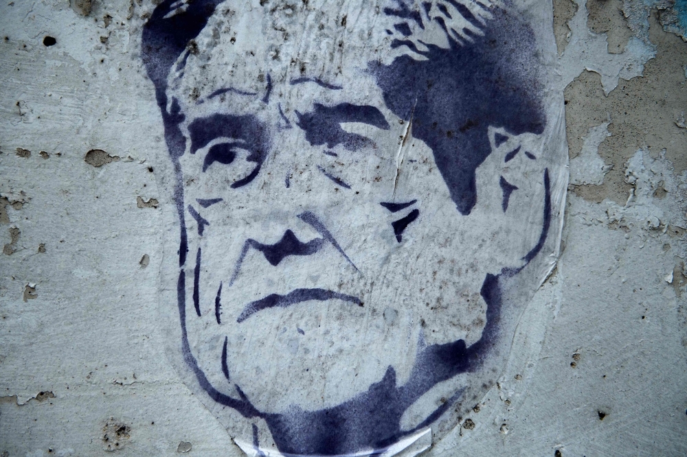 In this file photo taken on July 11, 2019 street art of former special council Robert Mueller is seen outside a construction site in Washington. -Courtesy photo