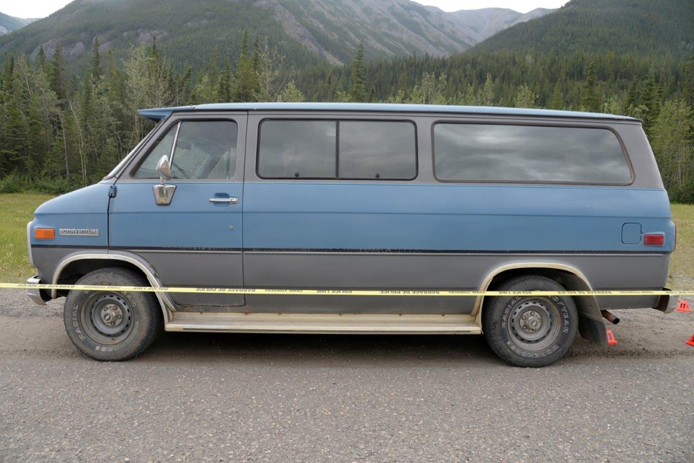 A blue 1986 Chevrolet van bearing Alberta licence plates is seen in an undated photo provided by the Royal Canadian Mounted Police (RCMP) at the site of a double homicide where Chynna Noelle Deese, 24, of the United States and Lucas Robertson Fowler, 23 of Australia were found dead near Liard Hot Springs, British Columbia, Canada. — Reuters