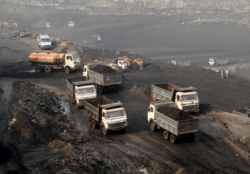 Trucks move in the Mahanadi coal fields, near Talcher town in the eastern state of Odisha, India, March 28, 2012. -Reuters photo