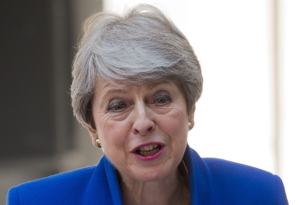 Britain's outgoing prime minister Theresa May gives a speech outside 10 Downing street in London on Wednesday before formally tendering her resignation at Buckingham Palace. — AFP