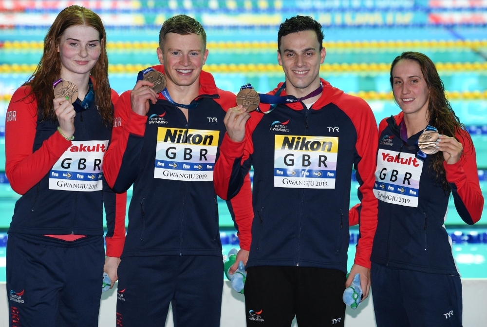 Bronze medalists, team Great Britain, Britain's Adam Peaty, Britain's Georgia Davies, Britain's James Guy, and Britain's Freya Anderson poses with their medals after the final of the mixed 4x100m medley relay event during the swimming competition at the 2019 World Championships at Nambu University Municipal Aquatics Center in Gwangju, South Korea, on Wednesday. — AFP