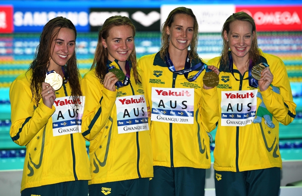 Gold medalists Australia's Ariarne Titmus, Australia's Madison Wilson, Australia's Brianna Throssell and Australia's Emma McKeon celebrate during the medals ceremony after the final of the women's 4x200m freestyle relay event during the swimming competition at the 2019 World Championships at Nambu University Municipal Aquatics Center in Gwangju, South Korea, on Thursday. — AFP