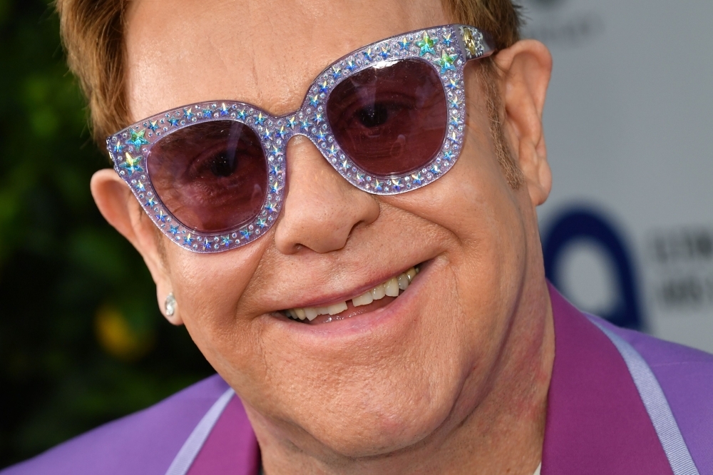 English singer-songwriter Elton John poses on the red carpet upon his arrival for the midsummer party of his AIDS Foundation, in Cap d'Antibes, near Antibes, southern France, on Wednesday. — AFP