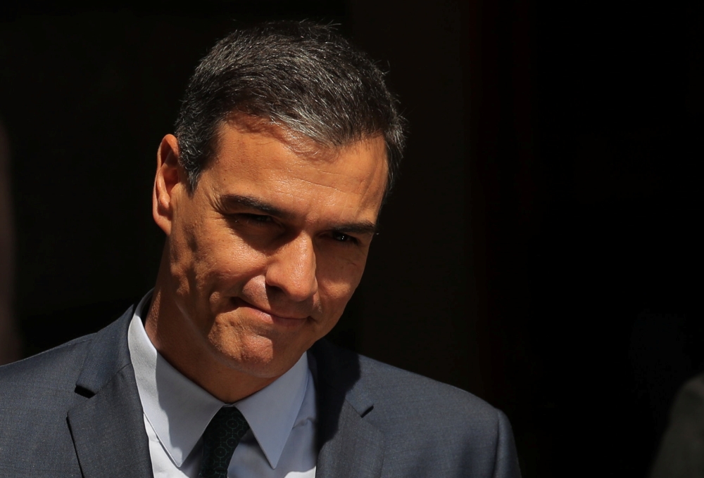 Spain's acting Prime Minister Pedro Sanchez leaves after the final day of the investiture debate at the Parliament in Madrid on Thursday. — Reuters