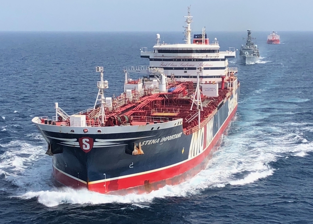 A handout picture taken on and released by the Ministry of Defense on Thursday shows the HMS Montrose (C) accompanying the Stena Important (L) and the Sea Ploeg vessels in the Gulf.  — AFP