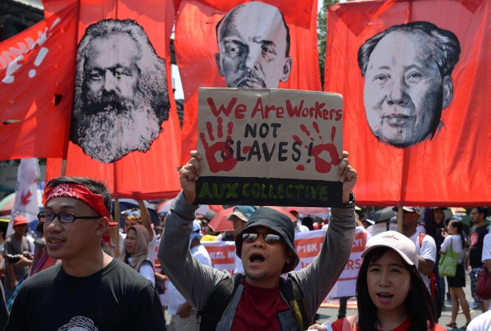 Workers shout slogans during a demonstration marking Labor Day in Manila in this May 1, 2019 file photo.— AFP