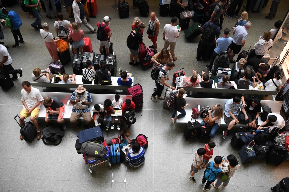 Passengers for the Eurostar wait at St Pancras international in central London after an electrical failure caused train cancellations on Friday. — AFP