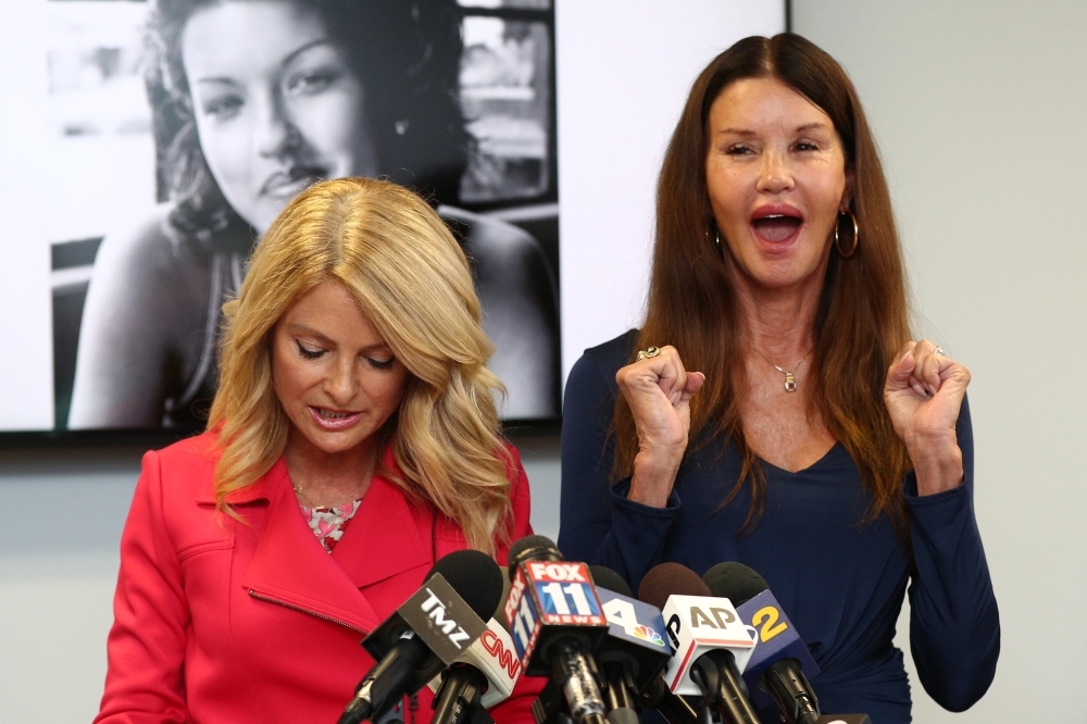 Attorney Lisa Bloom, left, and Janice Dickinson speak during a press conference to announce a settlement in their defamation lawsuit against Bill Cosby at The Bloom Firm in Woodland Hills, California, on Thursday. — AFP