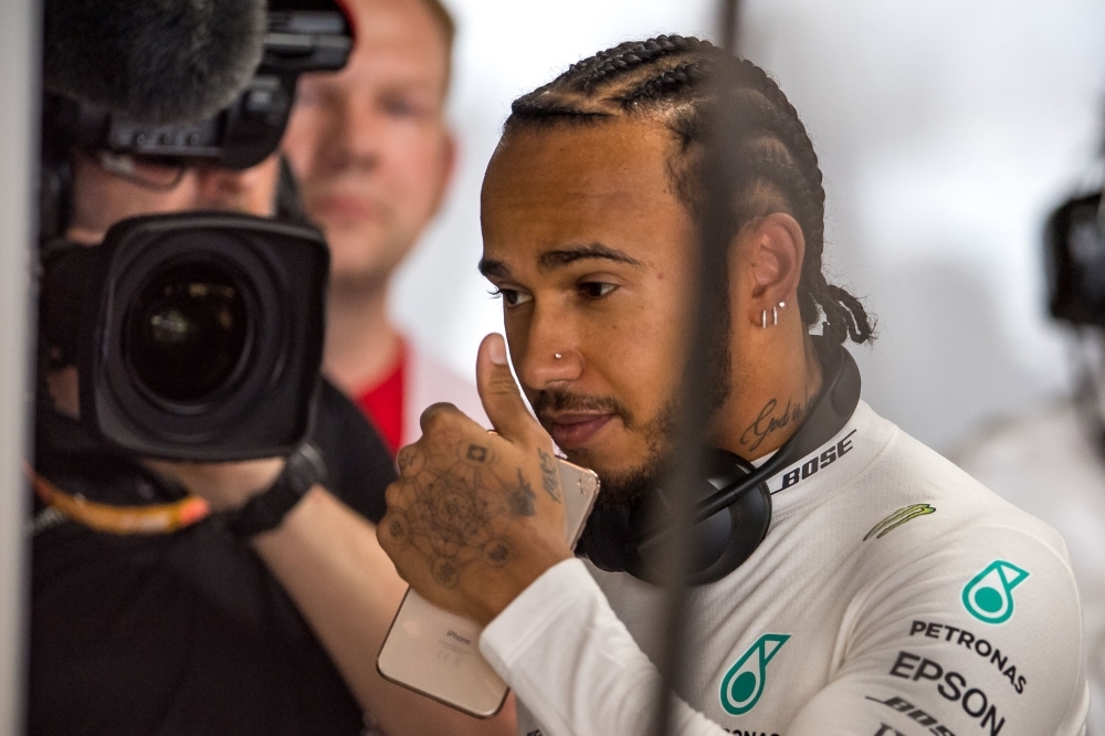 Mercedes' British driver Lewis Hamilton prepares to take part in the first practice session of the German Formula One Grand Prix at the Hockenheim racing circuit in Hockenheim, southern Germany, on Friday. — AFP