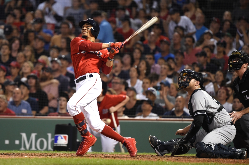 Boston Red Sox right fielder Mookie Betts hits his third home run of the game during the fourth inning against the New York Yankees at Fenway Park, Boston, MA, USA, on Friday. — Reuters