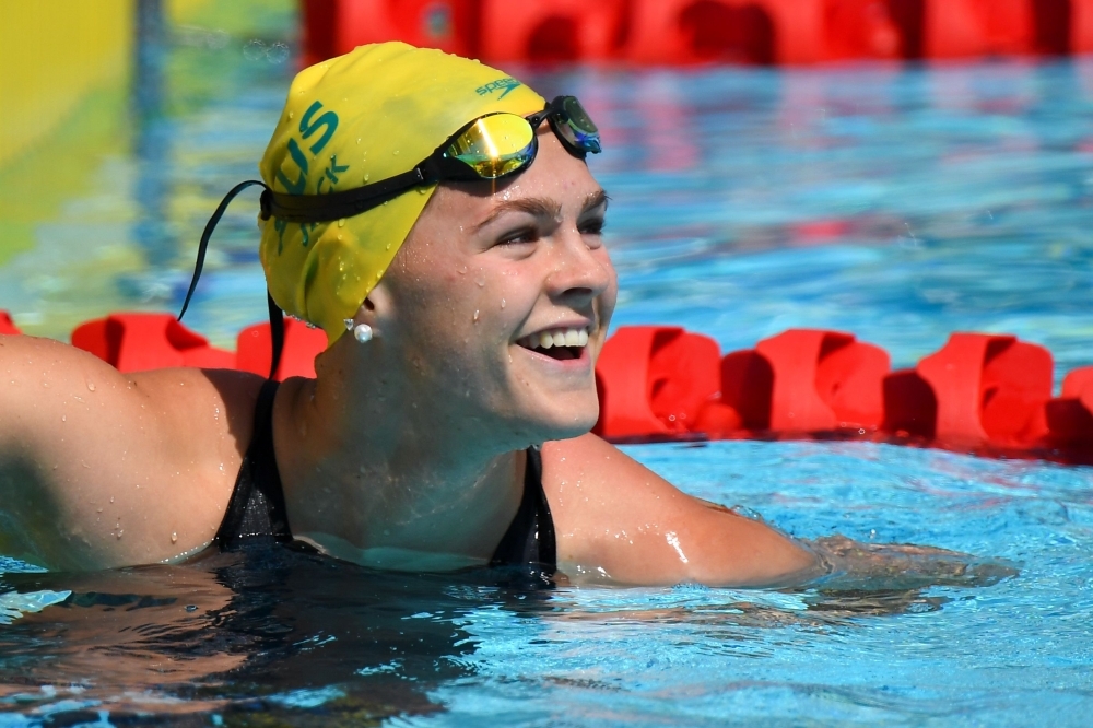 In this file photo taken on April 06, 2018, Australia's Shayna Jack smiles after the women's 50m freestyle qualifications during the 2018 Gold Coast Commonwealth Games at the Optus Aquatic Center in the Gold Coast. Jack has tested positive for a banned substance, Swimming Australia said on Saturday. — AFP