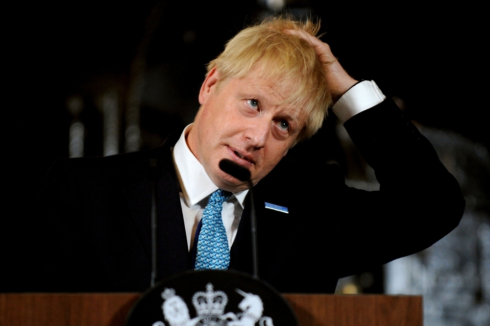 Britain's Prime Minister Boris Johnson gestures as he gives a speech on domestic priorities at the Science and Industry Museum in Manchester, northwest England on Saturday.  British Prime Minister Boris Johnson on Saturday said Brexit was a 