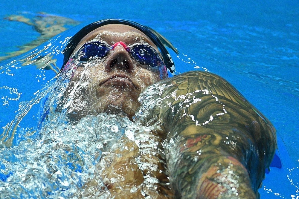 USA's Caeleb Dressel warms-down after in the diving pool after the final of the men's 100m butterfly event during the swimming competition at the 2019 World Championships at Nambu University Municipal Aquatics Center in Gwangju, South Korea, on Saturday. — AFP