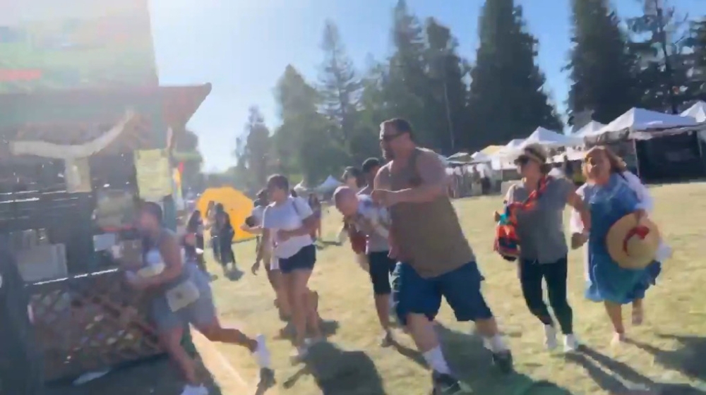 People run as an active shooter was reported at the Gilroy Garlic Festival, south of San Jose, California, on Sunday. -Reuters photo