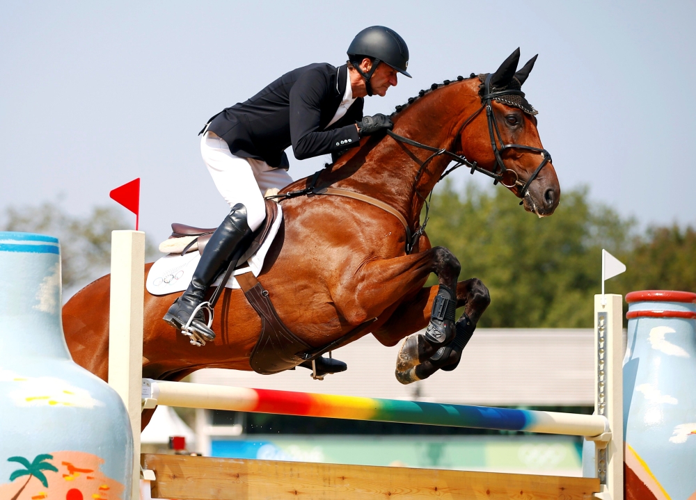 Mark Todd of New Zealand riding Leonidas II jumps during the Equestrian Eventing Team Jumping Final at the Olympic Equestrian Center in Rio de Janeiro, Brazil, in this Aug. 9, 2016, file photo. — Reuters
