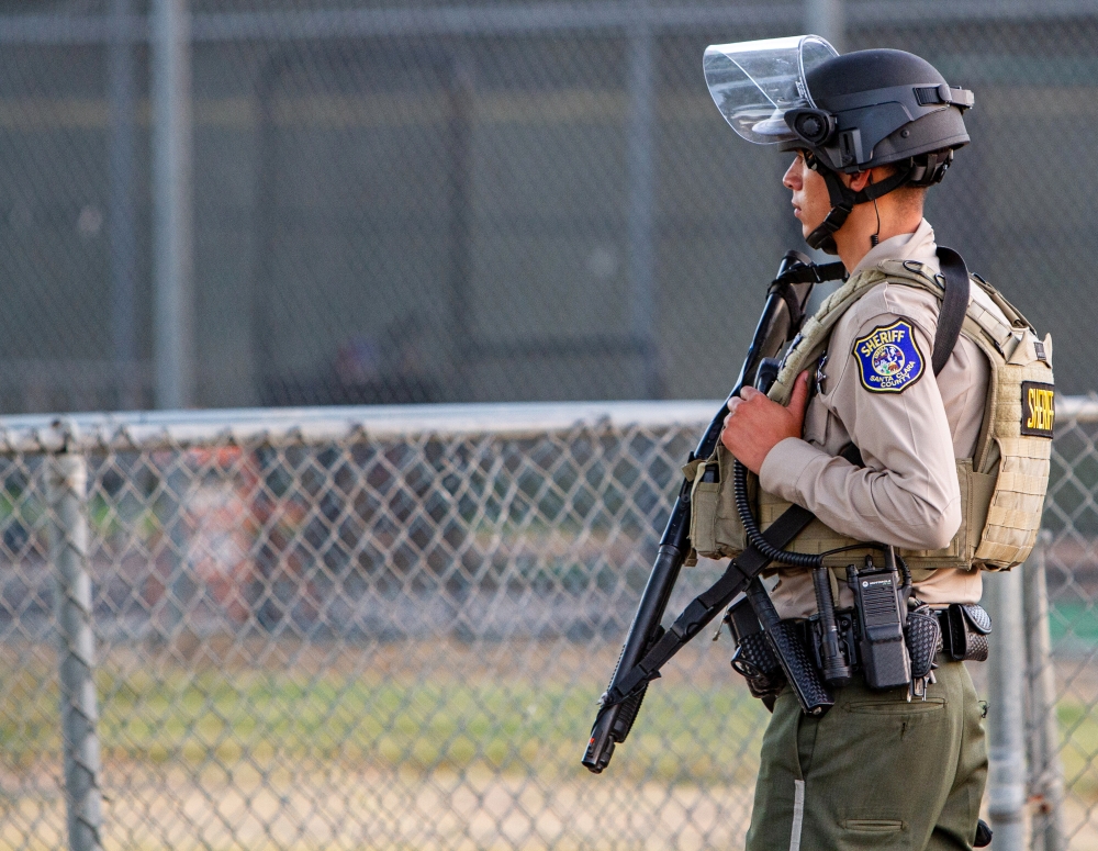 A police officer stands watch at the scene of a mass shooting during the Gilroy Garlic Festival in Gilroy, California, on Sunday. — Reuters