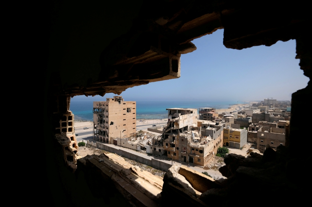 Destroyed buildings are seen through a hole in Benghazi lighthouse after it was severely damaged by years of armed conflict, in Benghazi, Libya, in this July 10, 2019 file photo. — Reuters